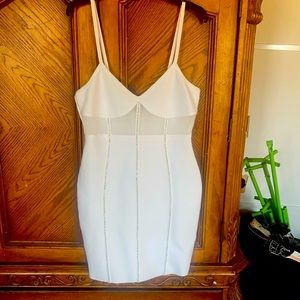 New white dress. Super cute with rhinestones and mesh like opening.